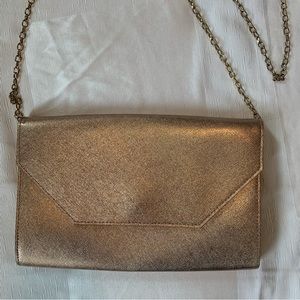 Metallic rose gold clutch crossbody purse with gold chain by Halogen